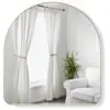 Image de Miroir mural cintré H 91cm laiton