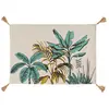 Image de Tapis imprimé feuillages exotiques à pompons coton multicolore 90x60cm