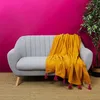 Image de Jeté de canapé surpiqué pompons jaune 130x150cm