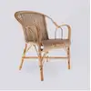 Image de Fauteuil patiné en rotin tressé