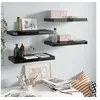 Image de Wandschappen zwevend 4 st 50x23x3,8 cm MDF hoogglans zwart323768