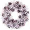 Image de Couronne de l'avent enneigée pommes de pin décoration noël - 35cm