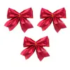 Image de Set de 3 noeuds rouges pour décoration sapin de noël 10cm