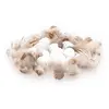 Image de Paquet de 40g de petits Oeufs factices avec plumes, Blanc