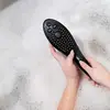 Image de Womanizer Wave - Pommeau de douche pour stimulation clitoridienne - Noir
