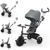 Image de Tricycle Kinderkraft Aston 2 PLUS avec poignée de poussée, siège pivotant à 360° « Click & Twist », pédales à roue libre, capote avec fenêtre, gris