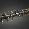 Image de Konstsmide Micro LED Guirlande lumineuse en grappe, avec multifonction, minuterie librement sélectionnable et variateur, réagit à la musique, contrôlée par app (Android & IOS), 960 diodes ambrées, transformateur extérieur 36V, câble noir - 6563-870
