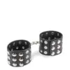Image de Menottes poignets cuir noir rivets