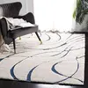Image de SAFAVIEH Tapis Shag pour Salon, Salle à Manger, Chambre à Coucher - Florida Shag Collection, Tapis à Poil Long, Crème et Bleu, 122 X 122 cm