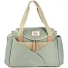 Image de BÉABA, Sac à Langer Sydney II, Modulable, Grande contenance, Rangements multiples, espace à cocoon, Pochette repas isotherme, Système attache poussettes, Anses transport, Vert Sauge