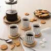 Image de Set de 4 tasses en porcelaine avec soucoupe bambou 10 cl motifs graphiques Mathon
