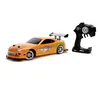 Image de Jada Toys Fast & Furious RC-Auto, Drift 1995 Toyota Supra, Turbo, Voiture télécommandée, fonction de dérive, 4 roues motrices, télécommande radio 2 canaux, fonction de charge USB, 4 pneus de rechange, 1:10, orange