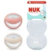Image de NUK Perfect Match Tétine pour bébé | 0-6 mois | Compatible avec l’allaitement, Sucettes orthodontiques | Taux d’acceptation par les bébés : 95 %** | Beige/Rouge | Lot de 2