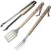 Image de Barbecook kit ustensiles barbecue avec spatule, fourchette et pince à barbecue en acier inoxydable et manche en bois de bouleau