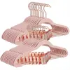 Image de SONGMICS Cintres pour Pantalons, 24 pièces, 42 cm, cintres avec Pinces réglables et Crochet Couleur Or, Cintre en Velours antidérapant, Gain de Place, pour Jupes, Rose Clair CRF14PK24, Standard