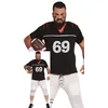 Image de FIESTAS GUIRCA | Costume de Quarterback Adulte (46-48/S) - T-shirt et Pantalon - Déguisement de Joueur de Football Américain pour Carnaval, Halloween et Fêtes Sportives - Idéal pour Hommes - Noir et