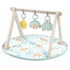 Image de INGENUITY Tapis déveil bébé Sun Valley arche de jeu en bois - 3 jouets amovibles - pliable