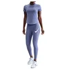 Image de Nike W NK Swift DF SS Top pour Femme, World Indigo/Reflective Silv, S, Indigo/argenté réfléchissant, S