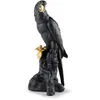Image de LLADRÓ Figurine en Porcelaine Ara Noir et Doré de Série Limitée. Sculpture en Porcelaine d'un Oiseau de la Collection Boldblack.