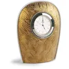 Image de LLADRÓ Horloge de Table Mirage en Porcelaine Blanche Mate et Lustre Doré avec Gravure Inspirée par Les Formes du Feu Appartenant à la Collection Mirage.