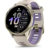 Image de Garmin® Forerunner® 970 Montre Intelligente GPS de Course et de Triathlon avec écran AMOLED, Lampe de Poche LED intégrée, Titane doré Doux avec boîtier Gris français et Bracelet Gris français/Indigo
