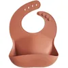 Image de mushie Bavoir Bébé en Silicone | Bavoirs Imperméables Réglables | Bavoirs Faciles à Essuyer | 4 Tailles Réglables Avec Poches Avant Profondes | 100% Sans BPA et Phtalate | Clay