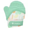 Image de bblüv - Glüv - Moufle Dentition Silicone, Sangle Ajustable, Mint | Massage apaisant multi-textures, sangle ajustable maintenue toute la journée, papier crissant, lavable en machine, dès 3 mois